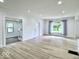 Large living room featuring wood-look floors, recessed lights and an open floor plan at 1920 E Epler E Ave, Indianapolis, IN 46227