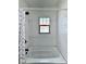 Shower featuring white subway tile, bronze fixtures and a patterned shower curtain at 1920 E Epler E Ave, Indianapolis, IN 46227