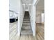New gray carpet leads up a staircase with a white banister and trim at 1920 E Epler E Ave, Indianapolis, IN 46227