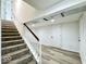 Basement staircase with neutral carpet and white trim leads to finished area at 1920 E Epler E Ave, Indianapolis, IN 46227