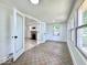 Bright sunroom leading to the living room, featuring tile floors and lots of light at 1920 E Epler E Ave, Indianapolis, IN 46227