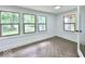Bright sunroom featuring many windows and vintage patterned tile floors at 1920 E Epler E Ave, Indianapolis, IN 46227