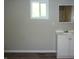 Bright bathroom featuring a white vanity, sink, and a medicine cabinet with a view from the window at 2007 Park Ave, Anderson, IN 46016