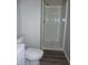 This bathroom has a white toilet and new shower at 2007 Park Ave, Anderson, IN 46016