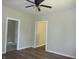 Bright bedroom featuring wood-look floors, neutral paint, and ceiling fan at 2007 Park Ave, Anderson, IN 46016
