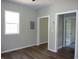 This living room offers luxury vinyl plank flooring, neutral walls and bright windows at 2007 Park Ave, Anderson, IN 46016