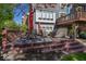 Backyard featuring a deck with outdoor seating, grill, dining area, and landscaping at 21218 Carlton Ct, Noblesville, IN 46062
