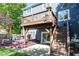 Backyard deck with a staircases down to the yard and plenty of outdoor seating at 21218 Carlton Ct, Noblesville, IN 46062
