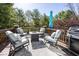 Backyard deck with a fire pit, grill, and plenty of outdoor seating at 21218 Carlton Ct, Noblesville, IN 46062