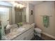 Bathroom with granite countertops, decorative mirror, and tiled flooring at 21218 Carlton Ct, Noblesville, IN 46062