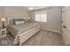 Cozy bedroom with a comfortable bed, neutral tones, and a bright window creating a serene and inviting atmosphere at 21218 Carlton Ct, Noblesville, IN 46062