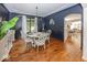 Dining room featuring elegant blue walls, hardwood floors and natural lighting at 21218 Carlton Ct, Noblesville, IN 46062