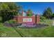 Community entrance featuring a brick sign for Carlton Heights, surrounded by landscaping and green grass at 21218 Carlton Ct, Noblesville, IN 46062