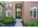 Close up of brick home entrance with double doors and arched window at 21218 Carlton Ct, Noblesville, IN 46062