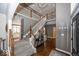 Two-story foyer featuring a grand staircase and hardwood floors at 21218 Carlton Ct, Noblesville, IN 46062