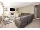 Inviting living room featuring comfortable seating, fireplace, TV, and built-in shelving at 21218 Carlton Ct, Noblesville, IN 46062