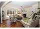 Bright living room with hardwood floors, fireplace, built-in shelves and large picture window at 21218 Carlton Ct, Noblesville, IN 46062