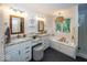 Serene main bathroom with double vanity, soaking tub, and stylish shiplap, creating a spa-like retreat at 21218 Carlton Ct, Noblesville, IN 46062