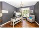 Home office with large window, hardwood floors and modern desk at 21218 Carlton Ct, Noblesville, IN 46062