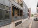 Exterior view of modern apartment building with private balconies at 222 N East St # 103, Indianapolis, IN 46204