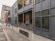 Exterior view of modern apartment building with private balconies at 222 N East St # 103, Indianapolis, IN 46204