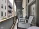 Cozy balcony space with comfortable seating and views of the surrounding neighborhood at 222 N East St # 103, Indianapolis, IN 46204