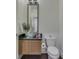 Modern bathroom features granite counters, vessel sink, and large mirror at 222 N East St # 103, Indianapolis, IN 46204