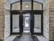 Interior building entrance featuring glass doors and stone facade at 222 N East St # 103, Indianapolis, IN 46204