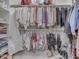 Walk-in closet with organized clothing and shoes, offering ample storage space at 222 N East St # 103, Indianapolis, IN 46204