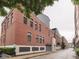 Brick apartment building featuring classic architectural details at 222 N East St # 103, Indianapolis, IN 46204