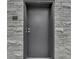 Stylish gray front door with stone surround and house number 103 at 222 N East St # 103, Indianapolis, IN 46204