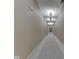 Long hallway with patterned carpet and neutral wall coverings at 222 N East St # 103, Indianapolis, IN 46204
