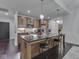 Contemporary kitchen with wooden cabinets, stainless steel appliances, and pendant lighting at 222 N East St # 103, Indianapolis, IN 46204