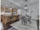 Modern kitchen open to dining area, with granite countertops and stainless steel appliances at 222 N East St # 103, Indianapolis, IN 46204