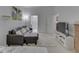 Living Room with a comfortable sofa, TV, and access to the bathroom at 222 N East St # 103, Indianapolis, IN 46204