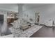 Bright living room showcasing the open layout, dining area, and access to the kitchen at 222 N East St # 103, Indianapolis, IN 46204
