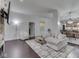 Open-concept living room and dining area with sleek hardwood floors and modern decor at 222 N East St # 103, Indianapolis, IN 46204