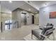 Lobby area featuring elevator, stairs, and seating at 222 N East St # 103, Indianapolis, IN 46204