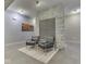 Lobby area with comfortable seating and stone accent wall at 222 N East St # 103, Indianapolis, IN 46204