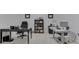 Bright home office with a desk, chair, bookshelf, and organized workspace at 222 N East St # 103, Indianapolis, IN 46204