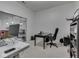 Modern office area with ample lighting, contemporary furnishings, and desk workspace at 222 N East St # 103, Indianapolis, IN 46204
