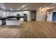 Open floor plan showing kitchen with island, granite countertops, and stainless steel appliances at 223 N Coventry Dr, Anderson, IN 46012