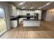 Bright kitchen with white cabinets, granite countertops and stainless steel appliances at 223 N Coventry Dr, Anderson, IN 46012