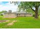 Large backyard and exterior of home, featuring stone facade at 3027 Griffa Ave, Columbus, IN 47203