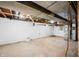 Unfinished basement featuring painted block walls and exposed ceiling at 3027 Griffa Ave, Columbus, IN 47203