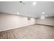 Finished basement featuring vinyl floors and recessed lighting at 3027 Griffa Ave, Columbus, IN 47203