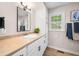 Bathroom featuring a modern sink, white cabinets, and stylish fixtures at 3027 Griffa Ave, Columbus, IN 47203