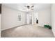 Bedroom with ceiling fan, carpet, and closet access at 3027 Griffa Ave, Columbus, IN 47203