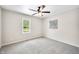 Cozy bedroom featuring plush carpeting and natural light from window at 3027 Griffa Ave, Columbus, IN 47203