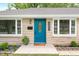 Close-up of the home's entrance, featuring a striking blue door and decorative details at 3027 Griffa Ave, Columbus, IN 47203